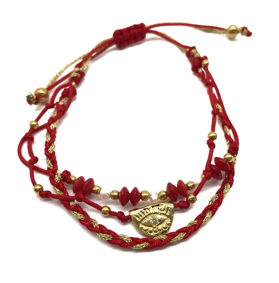 Pulsera triple tejida roja, con dije ojo